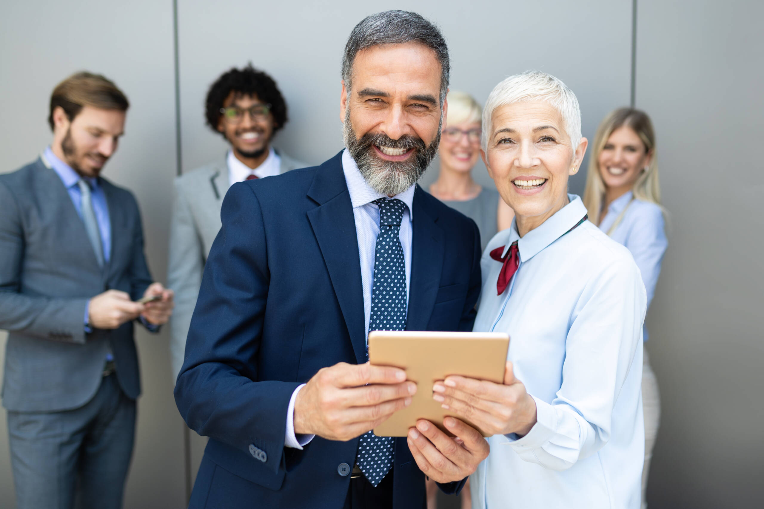Happy,Business,Colleagues,In,Modern,Office,Using,Tablet